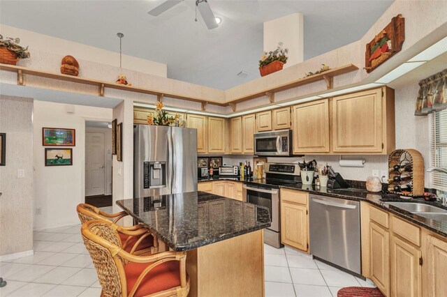 23104 Turnbull Ave, Port Charlotte, FL 33954 - kitchen featuring light brown cabinets, light tile patterned floors, a sink, and stainless steel appliances
