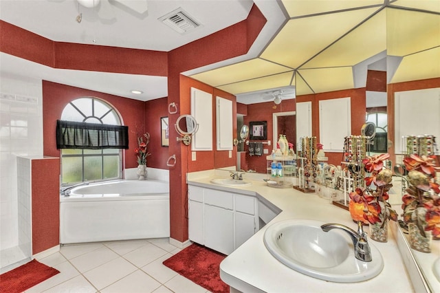 23104 Turnbull Ave, Port Charlotte, FL 33954 - full bathroom with a garden tub, tile patterned flooring, visible vents, a sink, and double vanity