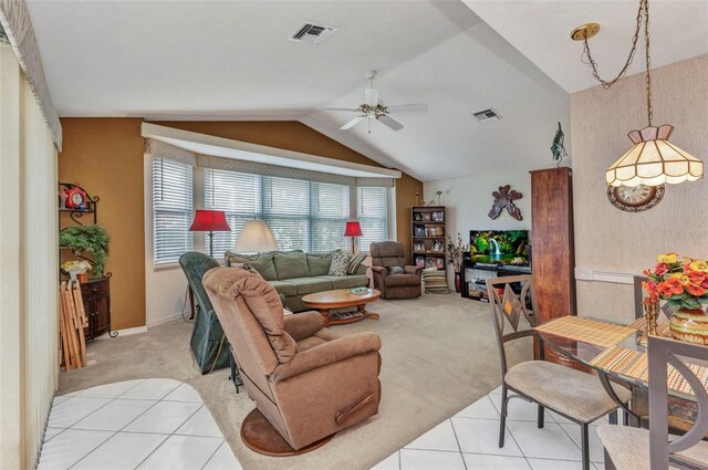 23104 Turnbull Ave, Port Charlotte, FL 33954 - living area with light carpet, ceiling fan, vaulted ceiling, and visible vents