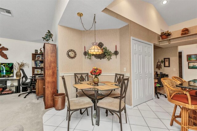 23104 Turnbull Ave, Port Charlotte, FL 33954 - dining space with visible vents, light tile patterned flooring, and lofted ceiling