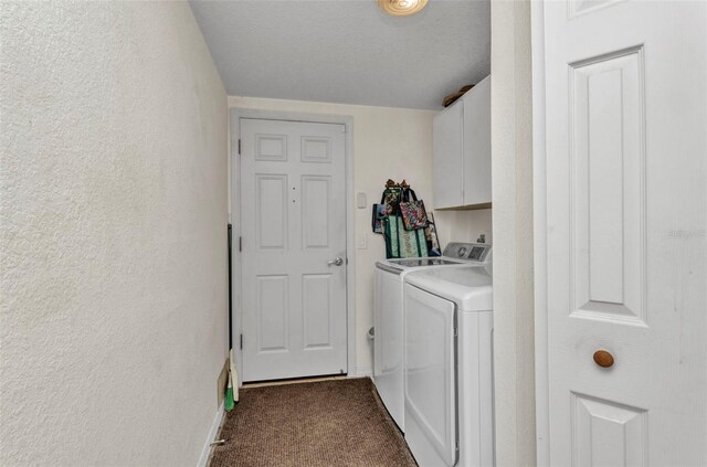 23104 Turnbull Ave, Port Charlotte, FL 33954 - laundry area featuring independent washer and dryer, dark carpet, a textured wall, baseboards, and cabinet space