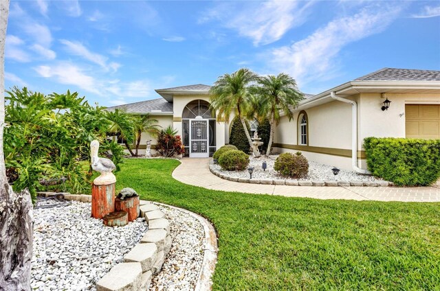 23104 Turnbull Ave, Port Charlotte, FL 33954 - mediterranean / spanish home with a front yard and stucco siding