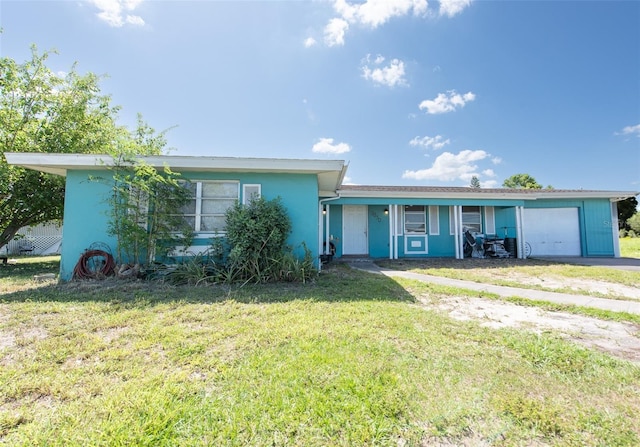 2230 Harbor Blvd, Port Charlotte, FL 33952 - ranch-style house with driveway, a front lawn, a garage, and stucco siding