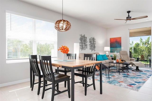 7209 W Lenox Cir, Punta Gorda, FL 33950 - dining area featuring baseboards, a ceiling fan, and light tile patterned flooring