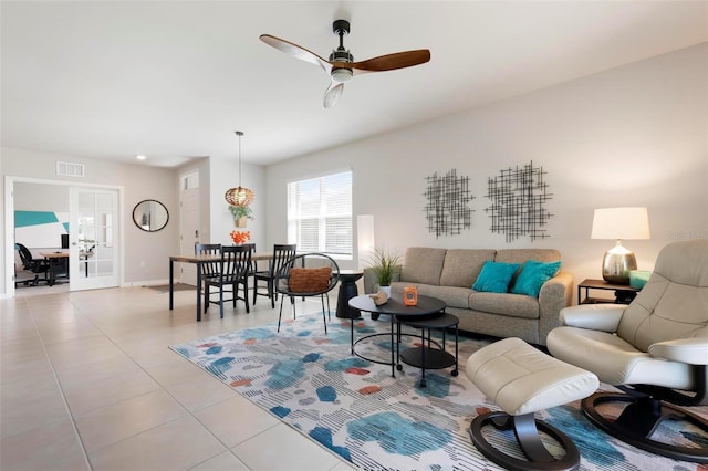 7209 W Lenox Cir, Punta Gorda, FL 33950 - living area with visible vents, light tile patterned floors, baseboards, ceiling fan, and french doors