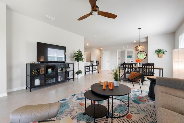 7209 W Lenox Cir, Punta Gorda, FL 33950 - living area featuring tile patterned floors, visible vents, baseboards, and a ceiling fan