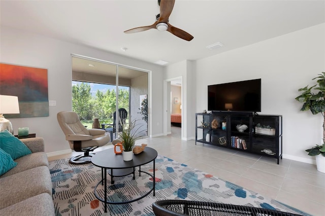 7209 W Lenox Cir, Punta Gorda, FL 33950 - living room featuring light tile patterned floors, baseboards, and a ceiling fan