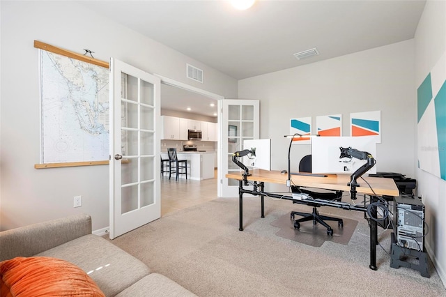 7209 W Lenox Cir, Punta Gorda, FL 33950 - home office featuring french doors, light colored carpet, and visible vents