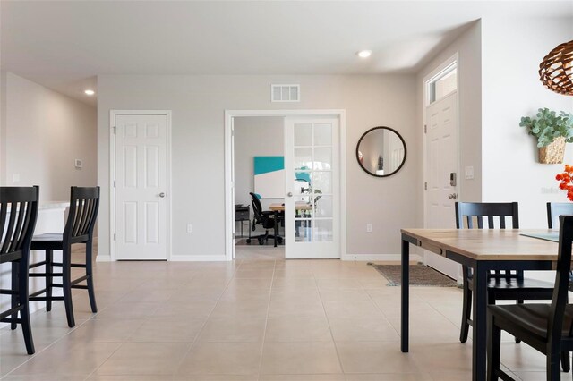 7209 W Lenox Cir, Punta Gorda, FL 33950 - dining room with french doors, light tile patterned floors, visible vents, and recessed lighting