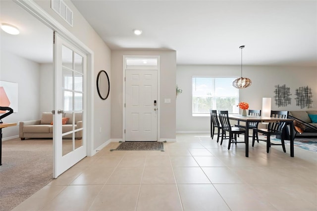 7209 W Lenox Cir, Punta Gorda, FL 33950 - entryway featuring visible vents, baseboards, french doors, and light tile patterned flooring