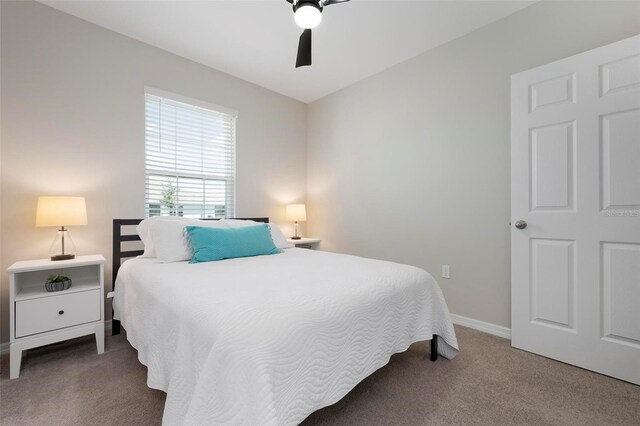 7209 W Lenox Cir, Punta Gorda, FL 33950 - carpeted bedroom featuring baseboards and ceiling fan
