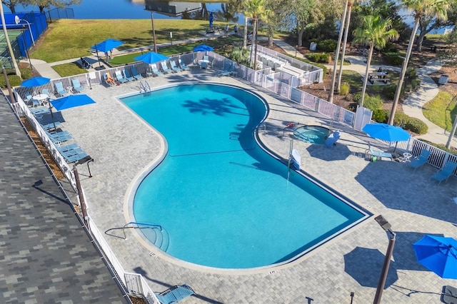 1085 Jonah Dr, North Port, FL 34289 - community pool featuring a patio area and fence