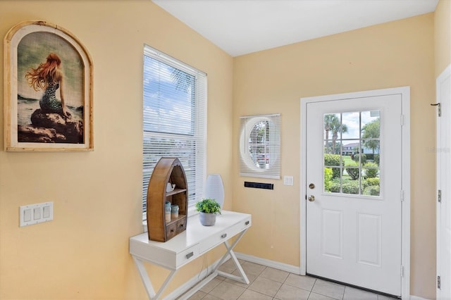 1085 Jonah Dr, North Port, FL 34289 - entrance foyer featuring light tile patterned floors and baseboards