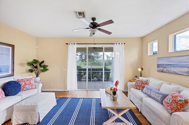 1085 Jonah Dr, North Port, FL 34289 - living area with a ceiling fan and wood finished floors