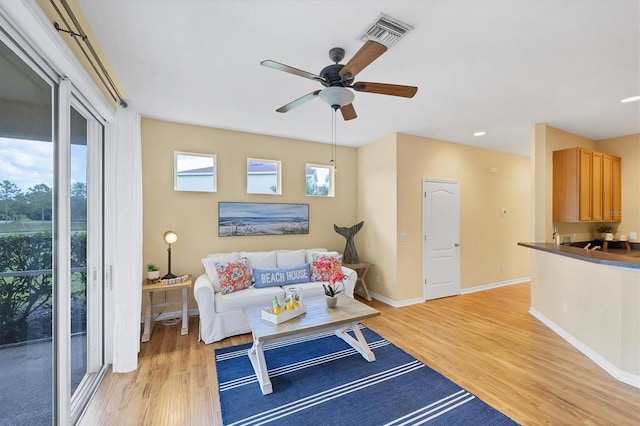 1085 Jonah Dr, North Port, FL 34289 - living room with light wood finished floors, ceiling fan, and recessed lighting