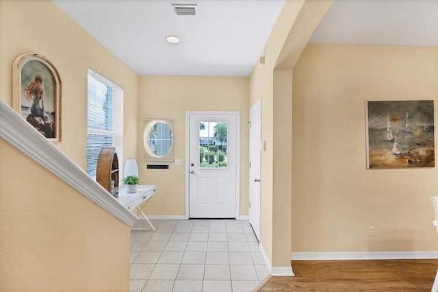 1085 Jonah Dr, North Port, FL 34289 - foyer with plenty of natural light and light tile patterned floors