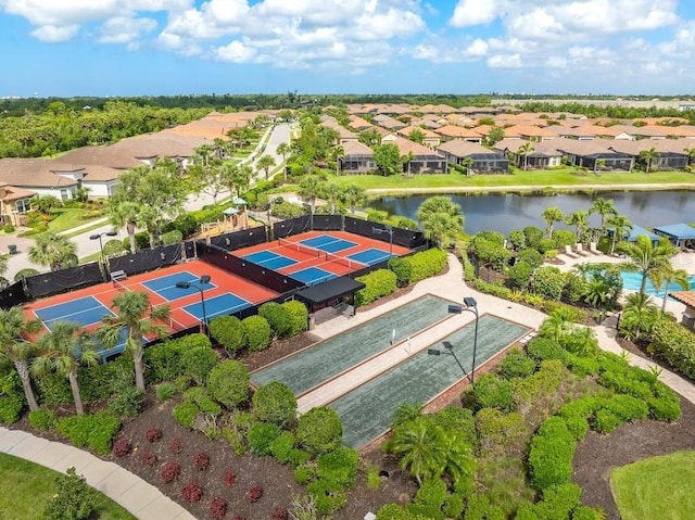 drone / aerial view featuring a water view and a residential view