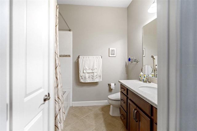 bathroom featuring vanity, toilet, shower / bath combo, tile patterned floors, and baseboards