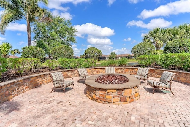 view of patio with a fire pit