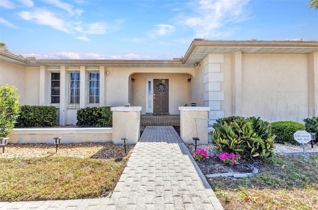 3824 Aves Island Ct, Punta Gorda, FL 33950 - doorway to property with stucco siding