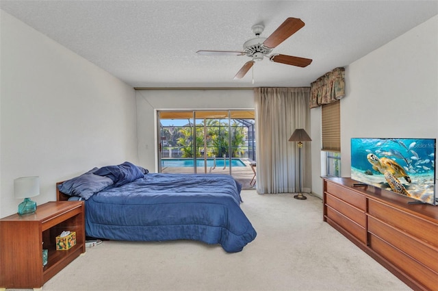 3824 Aves Island Ct, Punta Gorda, FL 33950 - bedroom with light carpet, a textured ceiling, access to exterior, ceiling fan, and a sunroom