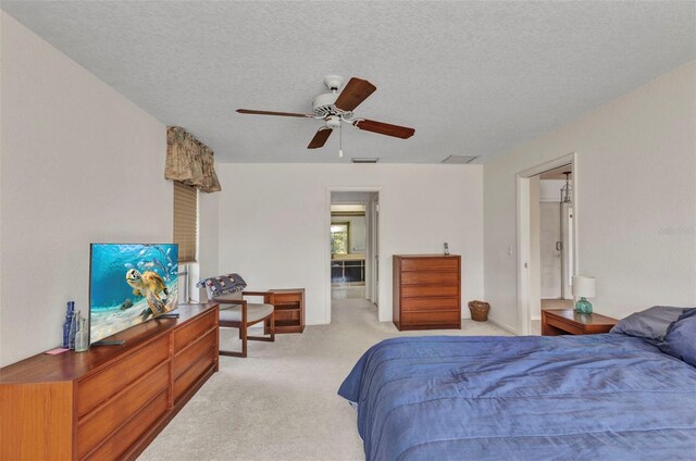 3824 Aves Island Ct, Punta Gorda, FL 33950 - bedroom featuring visible vents, light colored carpet, a textured ceiling, and a ceiling fan