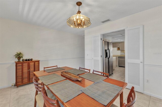 3824 Aves Island Ct, Punta Gorda, FL 33950 - dining space featuring visible vents, baseboards, an inviting chandelier, and light tile patterned flooring
