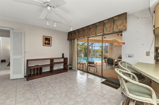 3824 Aves Island Ct, Punta Gorda, FL 33950 - interior space featuring rail lighting, light tile patterned floors, a sunroom, and ceiling fan
