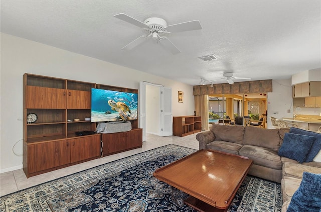 3824 Aves Island Ct, Punta Gorda, FL 33950 - living area with baseboards, light tile patterned floors, a textured ceiling, a ceiling fan, and visible vents