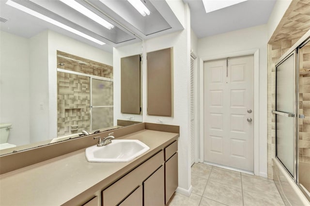 3824 Aves Island Ct, Punta Gorda, FL 33950 - bathroom with vanity, tile patterned flooring, visible vents, toilet, and a skylight