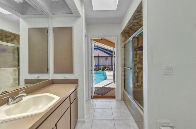3824 Aves Island Ct, Punta Gorda, FL 33950 - full bathroom featuring tile patterned floors, vanity, and bath / shower combo with glass door