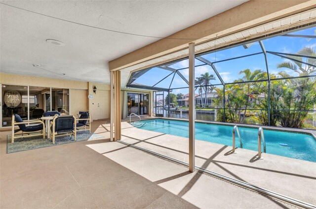 3824 Aves Island Ct, Punta Gorda, FL 33950 - outdoor pool with a patio and glass enclosure