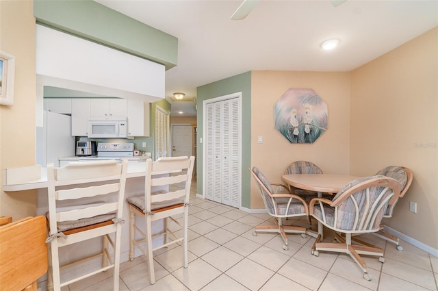 3187 Elkcam Blvd, Port Charlotte, FL 33952 - dining area featuring baseboards and light tile patterned floors