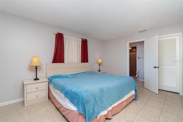 3187 Elkcam Blvd, Port Charlotte, FL 33952 - bedroom with light tile patterned floors and baseboards