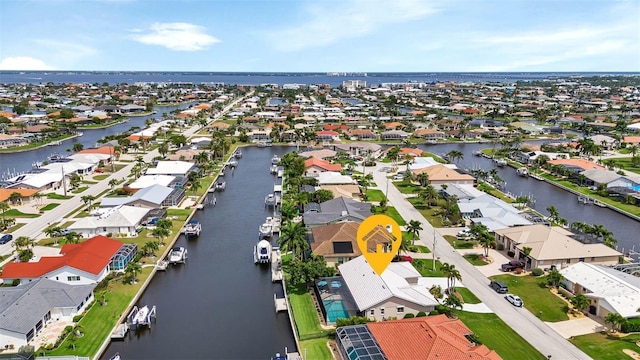 bird's eye view with a water view and a residential view