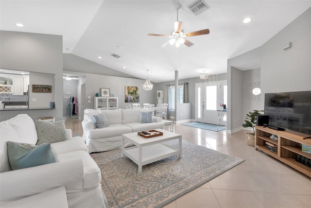 living room with visible vents, light tile patterned floors, a ceiling fan, recessed lighting, and lofted ceiling