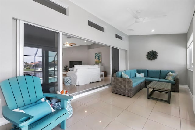 tiled living room featuring visible vents, baseboards, a ceiling fan, and recessed lighting