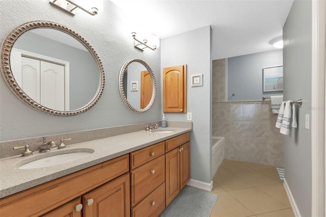 full bathroom featuring a sink, tile patterned floors, and double vanity