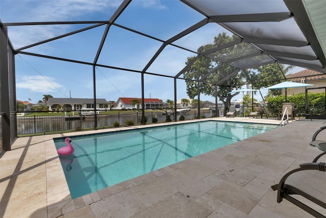 view of swimming pool featuring a fenced in pool, a patio area, glass enclosure, and fence