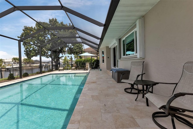 view of swimming pool featuring a fenced in pool and a patio