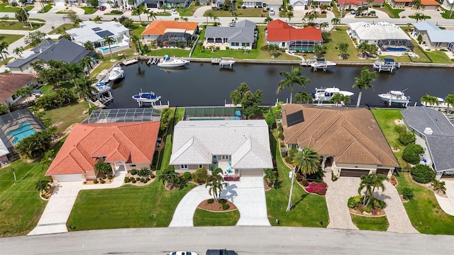 birds eye view of property featuring a water view and a residential view