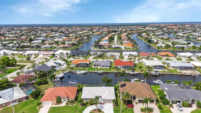 aerial view with a water view and a residential view