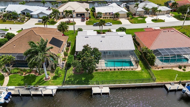 birds eye view of property featuring a water view and a residential view
