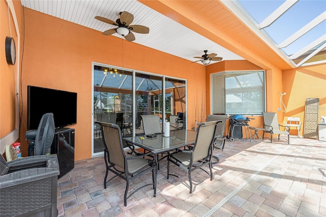 view of patio featuring ceiling fan and outdoor dining area