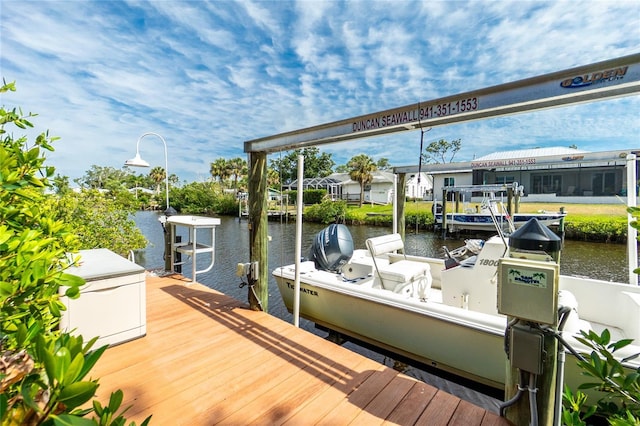dock area featuring a water view and boat lift