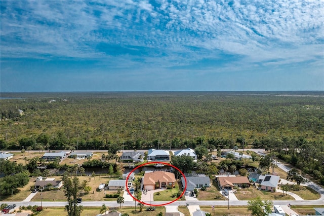 bird's eye view with a residential view and a view of trees