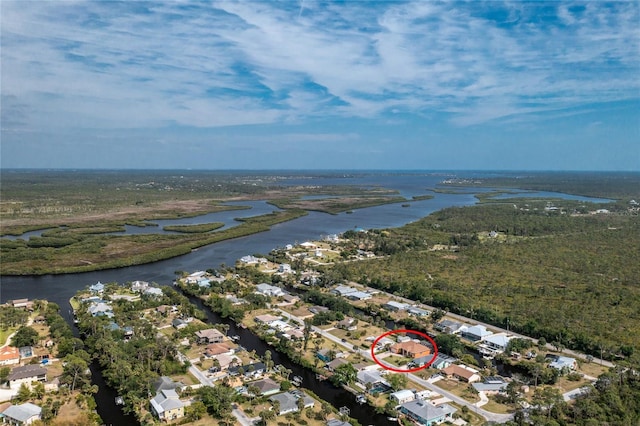 birds eye view of property featuring a water view and a residential view