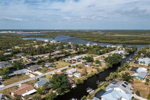 birds eye view of property with a water view and a residential view