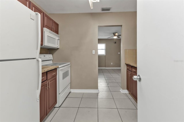 21242 Coulton Ave, Port Charlotte, FL 33952 - kitchen with baseboards, white appliances, light tile patterned floors, a ceiling fan, and visible vents