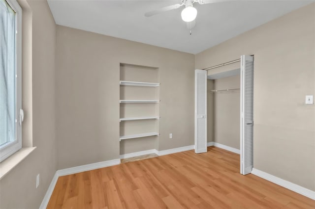 21242 Coulton Ave, Port Charlotte, FL 33952 - unfurnished bedroom with a closet, ceiling fan, baseboards, and wood finished floors